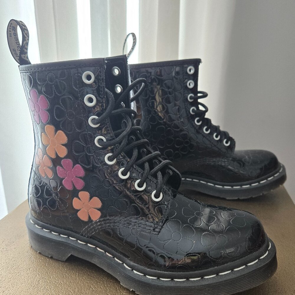 Patent leather Dr. Martens boots.